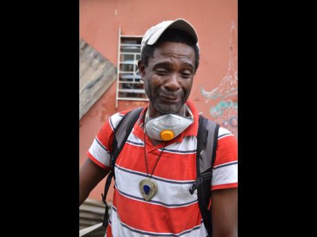 Maurice Ellis cries as he explains how he lost everything in a fire on Wednesday.