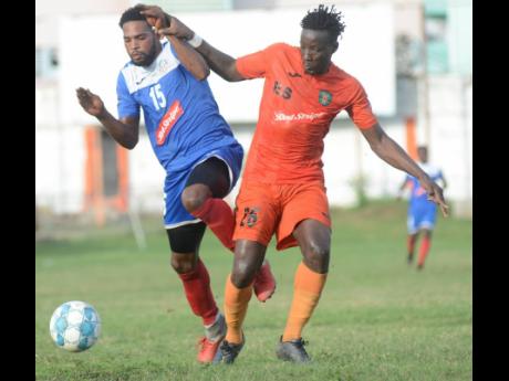 Tivoli Gardens’ Jabeur Johnson (right) challenges Cleon Pryce of Portmore United during their Red Stripe Premier League match at the Edward Seaga Sports Complex November 17, 2019. 
