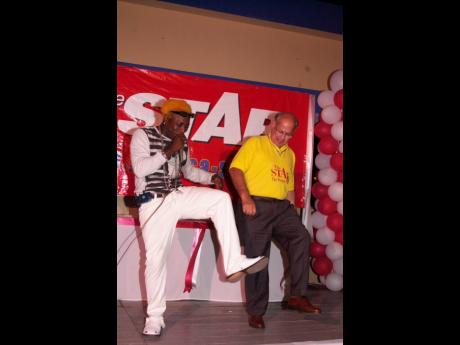 Credit: Ian Allen Elephant Man teaches Oliver Clarke the latest dance moves at THE STAR Awards in 2002.
