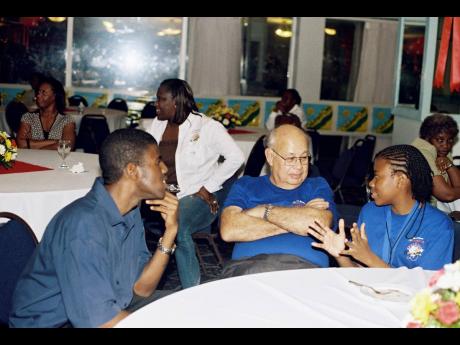 Credit: Oliver Clarke (centre) loved The Gleaner’s Children’s Own Spelling Bee competition. Here at the 2007 champions’ dinner, he listens keenly to Lawre Johnson, who was runner-up that year, and Daniel Thomas, 2001 winner.