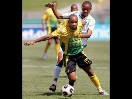 
Jamaica’s Jermaine Hue breaks away from South Africa’s Nkosi during the second half of their CONCACAF Gold Cup match in 2005. Hue scored Jamaica’s opening goal in a 3-3 draw. 