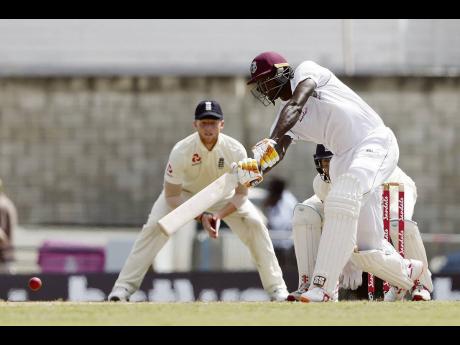 Windies’ captain Jason Holder  plays a shot against England during day three of their first Test match at the Kensington Oval in Bridgetown, Barbados, last January.