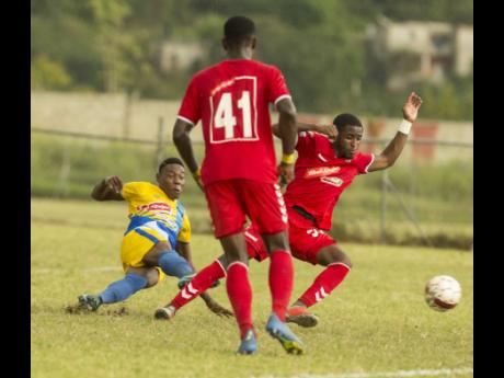 In this file photo from January 2019, Shemar Nairne (left), then of Harbour View, scores against UWI in a Red Stripe Premier League game at the UWI Mona Bowl.