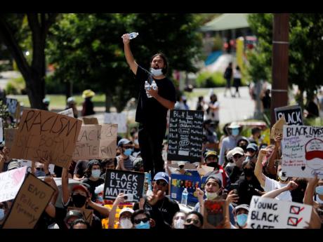 Demonstrators chant their slogans during a protest Thursday, June 4, in Los Angeles, over the death of George Floyd on May 25 in Minneapolis.