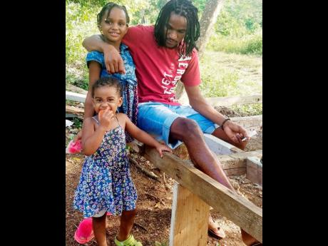 Recording artiste Lee Dann and his daughters.