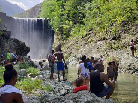 Reggae Falls attracted scores of persons on Sunday as COVID-19 restrictions, which prohibited the use of beaches and rivers, were lifted.