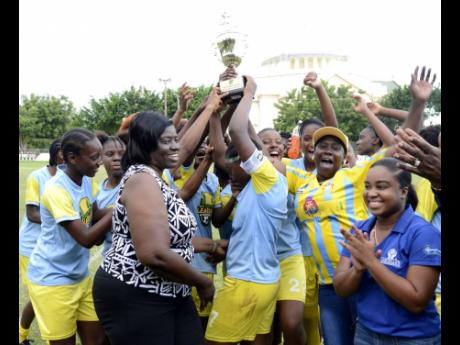 Waterhouse Women FC celebrate with their JFF Women’s League Mid Season final trophy after defeating Arnett Gardens 2-1 in the final on Sunday, August 19, 2018.