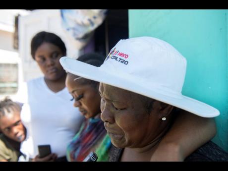 Credit: File Marjorie Powell (right), mother of former national footballer, Irvino English.