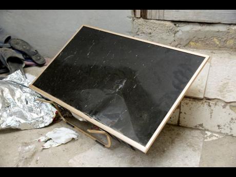 This flat screen television is among the items that fleeing Trench Town residents say were destroyed by vandals.