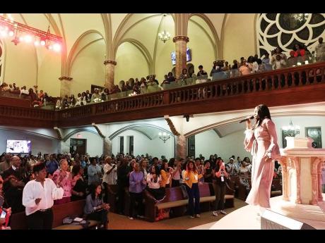 MAKING A JOYFUL NOISE. Minister/Evangelist Judith Gayle has the attention of a sold-out audience at a recent concert.