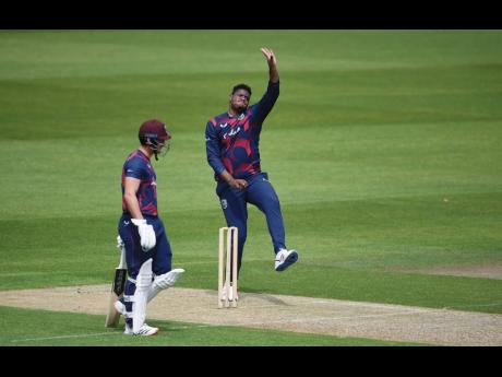 Credit: contributed Oshane Tomas bowls for Brathwaite XI on Day 2 of the West Inides second warm-up match at Old Trafford.