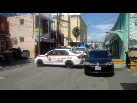 The crime scene in Montego Bay yesterday where robbers shot a security guard.
