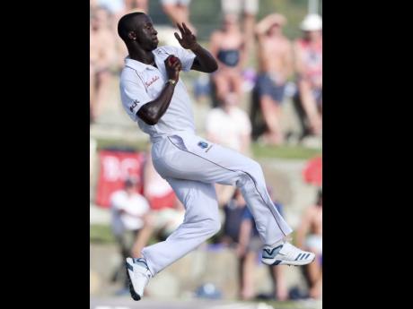 West Indies’ Kemar Roach bowls against England during day one of the second Test cricket match at the Sir Vivian Richards Stadium in North Sound, Antigua and Barbuda, Thursday, January 31, 2019.
