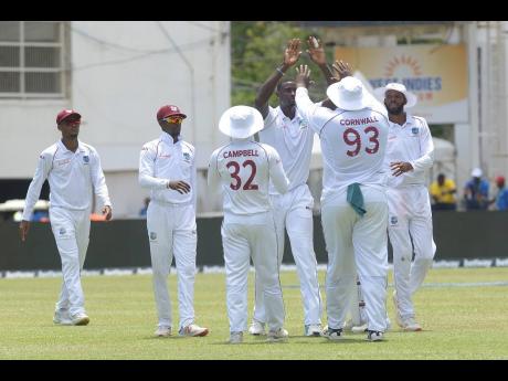 Credit: Jason Holder (third right) celebrates with teammate Rahkeem Coornwall who caught India’s Marayank Agarwal off his delivery on day one of their second Test match at Sabina Park in Kingston, Jamaica, on Friday, August 30, 2019.