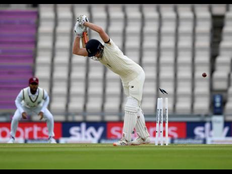 England’s Dom Sibley is bowled out on the first day of the 1st cricket Test match between England and West Indies, at the Ageas Bowl in Southampton, England, yesterday.