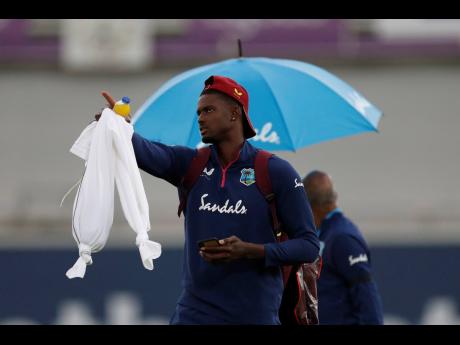 West Indies’ captain Jason Holder gestures as he leaves the field at the end of first day of the 1st cricket Test match between England and West Indies, at the Ageas Bowl in Southampton, England, yesterday.