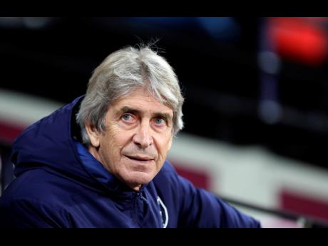 FILE
In this Monday, December 9, 2019 file photo, West Ham’s manager Manuel Pellegrini looks out from the bench before their English Premier League match against Arsenal at the London Stadium in London. 