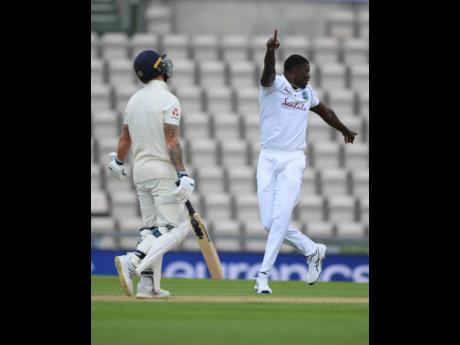 West Indies’ captain Jason Holder, right, celebrates the dismissal of England captain Ben Stokes, left, during the second day of the first cricket Test match between England and West Indies, at the Ageas Bowl in Southampton, England, Thursday, July 9, 2020. 