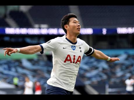 Tottenham’s Son Heung-min celebrates after scoring his side’s first goal during the English Premier League match against Arsenal at the Tottenham Hotspur Stadium in London, England, on Sunday. 