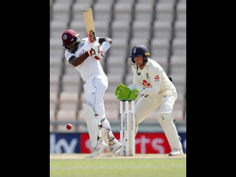 Jermaine Blackwood (left) plays a shot during the fifth day of the first cricket Test match between England and West Indies at the Ageas Bowl in Southampton, England, Sunday, July 12, 2020. 