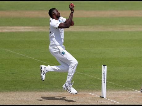 Credit: AP Windies’ captain Jason Holder in stride delivering a ball during the fourth day of the first cricket Test match against England at the Ageas Bowl in Southampton, England, on Saturday.