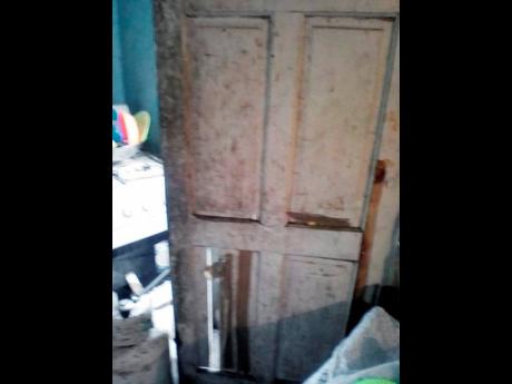 Credit: Contributed The busted door at the entrance to the woman’s home.