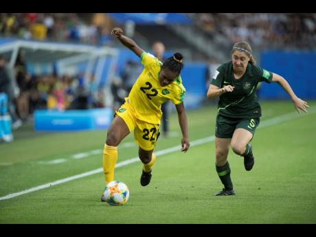 Jamaica’s Mireya Grey dribbles away from Australia’s Karly Roestbakken during a FIFA Women’s World Cup first-round match on June 18, 2019. 