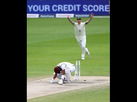 Credit: AP Windies’ Shai Hope is bowled by England’s Stuart Broad during the last day of their second Test match at Old Trafford in Manchester, England, yesterday.