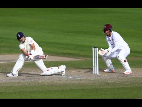 Credit: Michael Steele England’s captain Joe Root plays a shot during the third day of the third cricket Test match between England and West Indies.