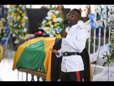 Constable Gwayne Lynch performing 'Hallelujah' at the funeral for slain cop Decardo Hylton held at the Bread of Life Ministries, Linstead, St Catherine.