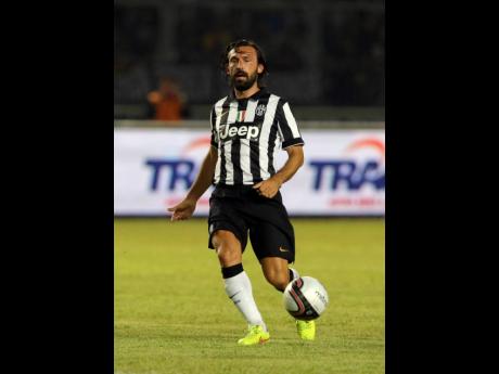 In this August 6, 2014, file photo, Juventus’ Andrea Pirlo controls the ball during a friendly match against Indonesia Super League All-Stars at Gelora Bung Karno stadium in Jakarta, Indonesia. 