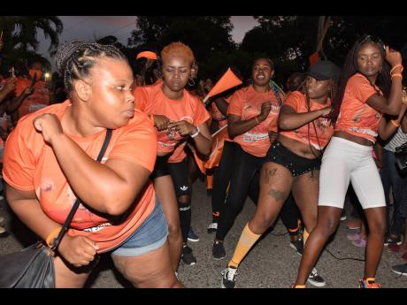 People’s National Party supporters dancing in the streets of Redwood, St Catherine, during a motorcade that toured the St Catherine North Eastern constituency on Saturday. The PNP’s Oswest Senior-Smith will be challenging the Jamaica Labour Party’s Kerensia Morrison.