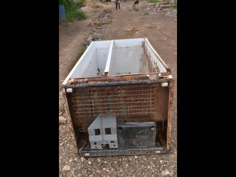 Credit: Errol Crosby This is one of the old fridges that Harris says was washed into her yard.