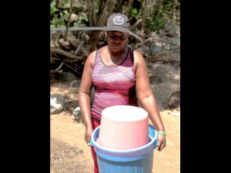 Credit: Romardo Lyons Cane River resident Dionne Lewis has been struggling to get water to do basic tasks such as laundry.