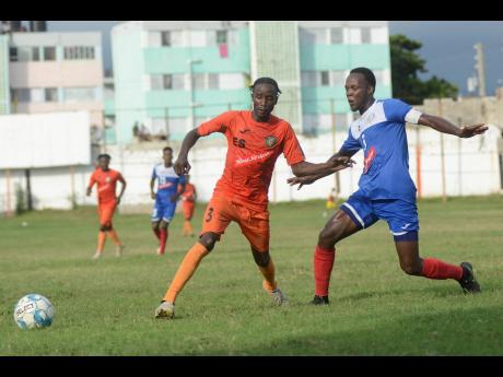FILE
Tivoli’s Davian Garrison challenges Ryan Wellington of Portmore United for a loose ball during their RSPL match at the Edward Seaga Sports Complex on Sunday, November 17, 2019.