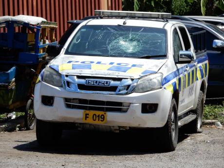The police vehicle that was damaged by defiant partygoers in Parry Town, St Ann last Saturday.