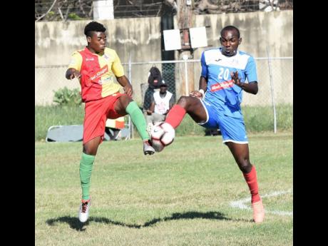 Humble Lion’s Shamar Rhoeden challenges Portmore United’s Rondee Smith for the ball during a National Premier League match on January 5, 2020.