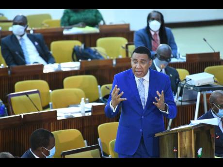 Prime Minister Andrew Holness speaking at the sitting of the House of Representatives at the Jamaica Conference centre on Tuesday.