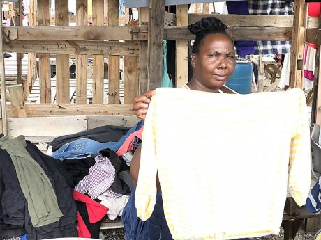 Credit: Romardo Lyons Sherese, a vendor on West Street in downtown Kingston.