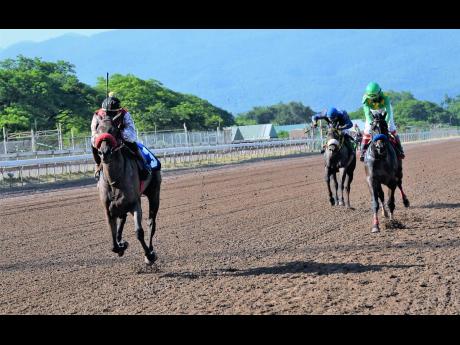 MR PANTHEON (left) ridden by Tevin Foster wins the eight race at Caymanas Park, on Saturday, September 19.