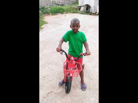 This four-year-old boy, Dominic Groves, was robbed of his goat in Malvern, St Elizabeth, last Saturday.