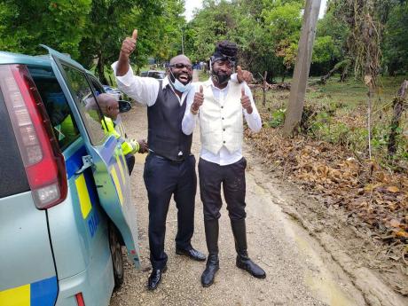 Richie Stephens (left) and  Beenie Man at the funeral in St Elizabeth on Sunday for Lilieth Sewell, Beenie Man’s mother.