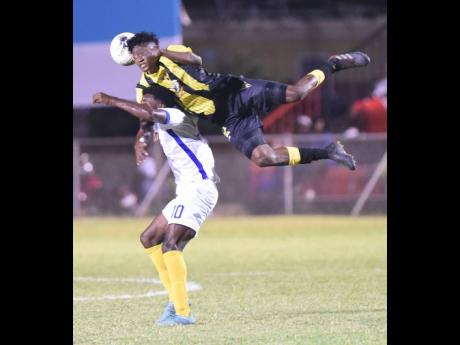 File
Don Basco’s Danley Jean Jacques (right) outjumps Waterhouse’s Kenroy Howell during their Concacaf League match on February 2, 2020.