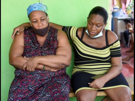 Credit: Nicholas Nunes/Photographer Hunter’s mother Marcia White (left) and common-law wife Meliesa Dewar, try to make sense of his murder.