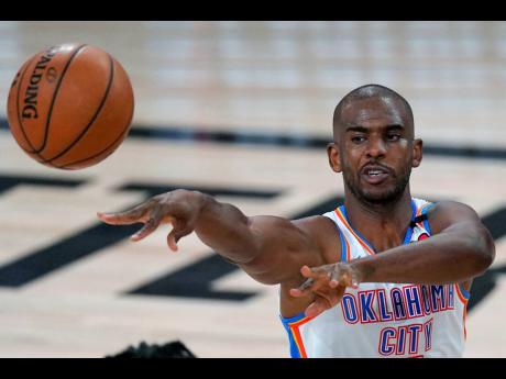 Oklahoma City Thunder’s Chris Paul makes a pass during the first half of an NBA first-round play-off game against the Houston Rockets in Lake Buena Vista, Florida, in this Wednesday, September 2, 2020 file photo. 