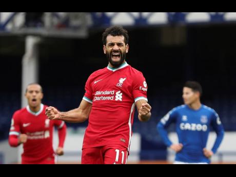 In this October 17, 2020 file photo, Liverpool’s Mohamed Salah celebrates scoring his side’s second goal during the English Premier League match against Everton at Goodison Park stadium in Liverpool, England. 