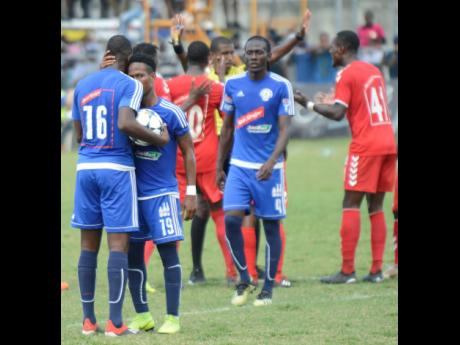 File
Mount Pleasant’s Fancios Swaby and Cardel Benbow converse after their team was awarded a penalty against UWI FC in a quarter-final encounter in the National Premier League on March 31, 2019. 