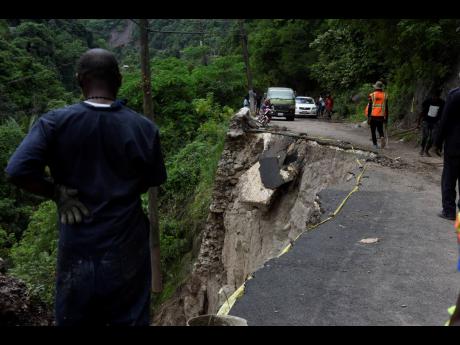 The Gordon Town main road, in the vicinity of Stand Up Hill, has been closed to all forms a traffic after a huge section of the roadway collapsed during heavy rains recently.
