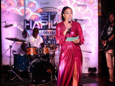 Tamiann Young hosting the Hapilos Sip & Stream virtual event last Friday at Tuff Gong International recording studio in St Andrew.