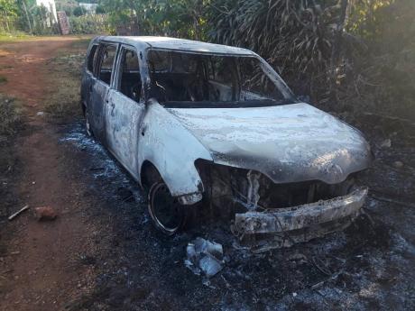 Angry residents burnt this motor car after Glester White Sr was killed, allegedly by a cop in the community yesterday.